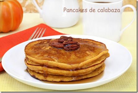 Pumpkin pancakes with pecans and syrup.